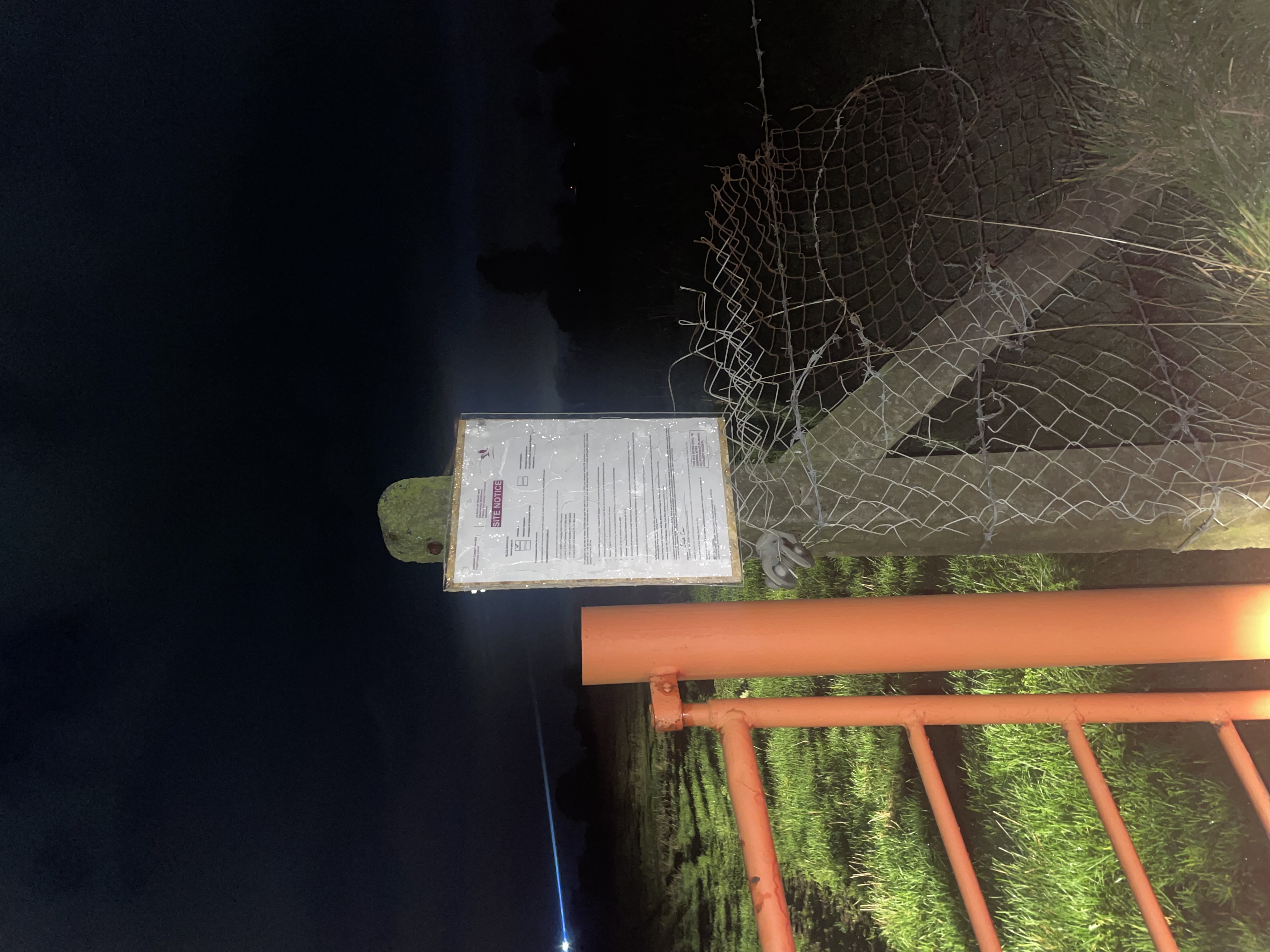 Site notice on security fence